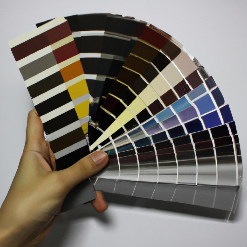 Person holding color swatches, decorating